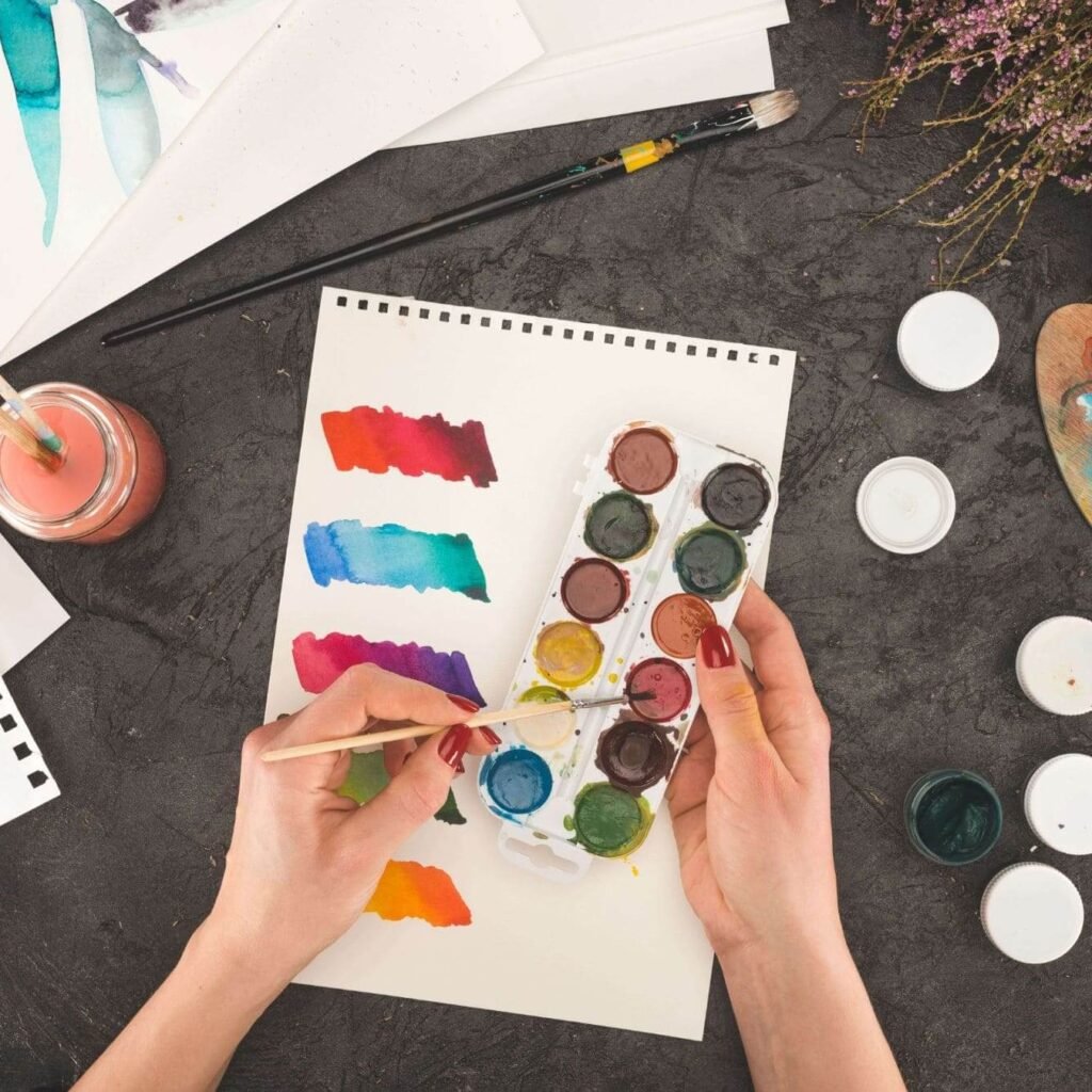cropped image of artist mixing watercolor paints 697kmle