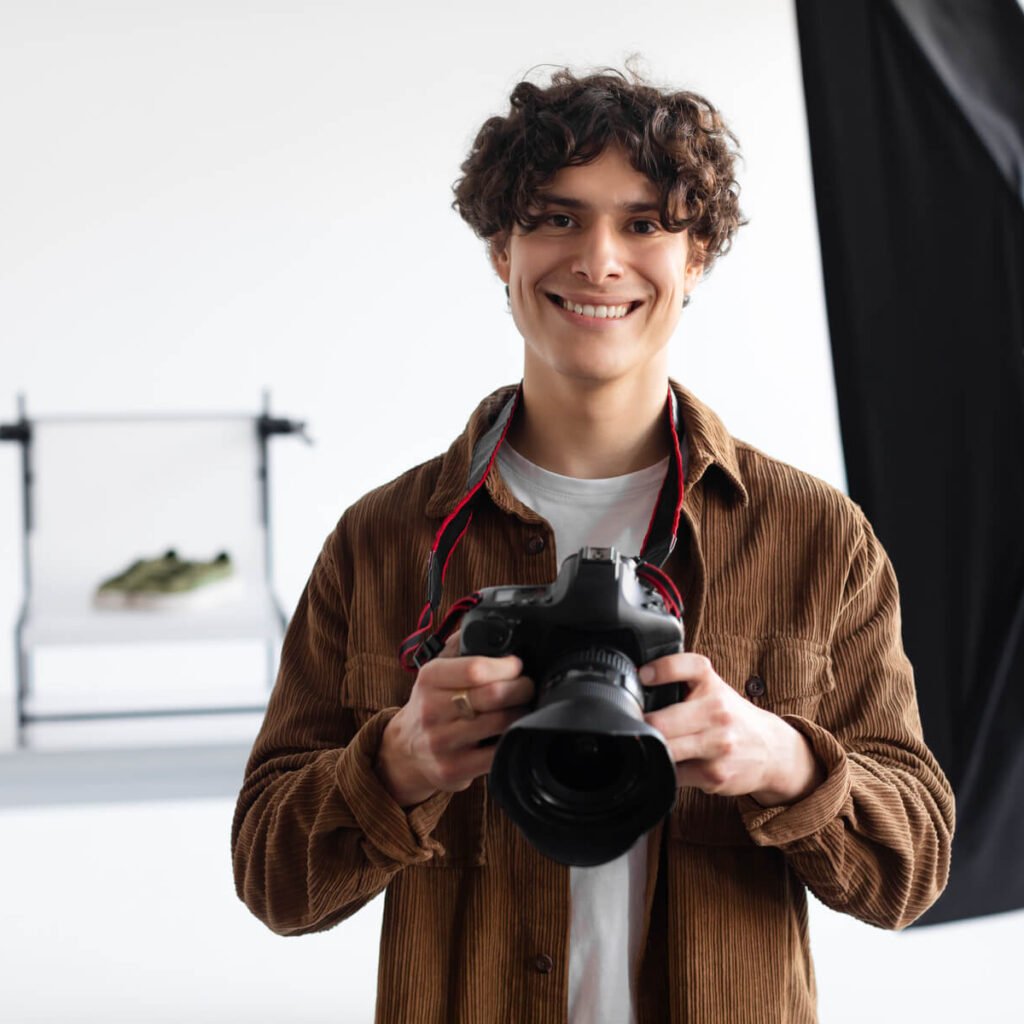 professional photographer man holding photocamera 2023 11 27 05 09 03 utc (1) (1)