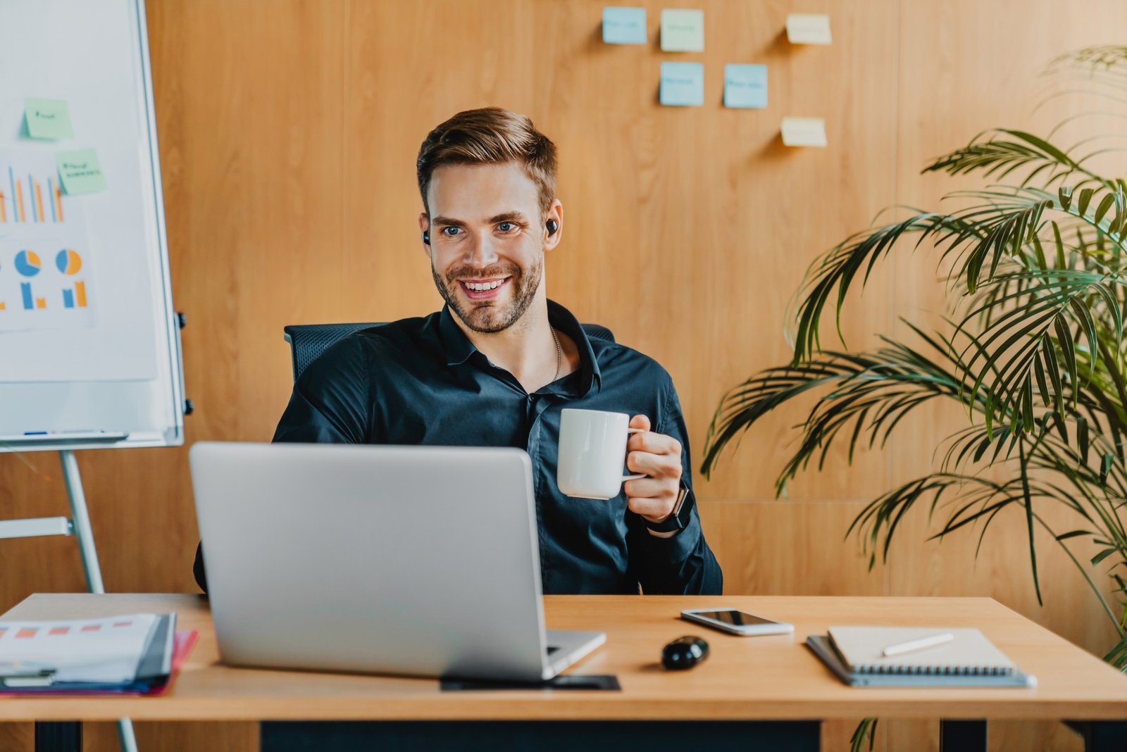 cheerful caucasian man working with laptop and wir 2023 11 27 04 46 23 utc 1 1.jpg